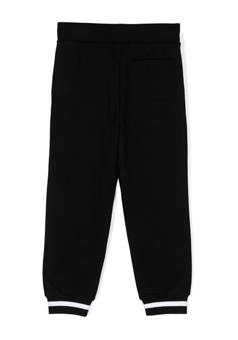 Pantalone tuta nero con elastico alla caviglia e stampa Balmain Kids BALMAIN PARIS KIDS | PANTALONI E JEANS | BV6R10Z0081930BC